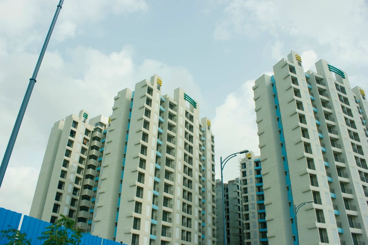 A group of tall buildings with sky in the background